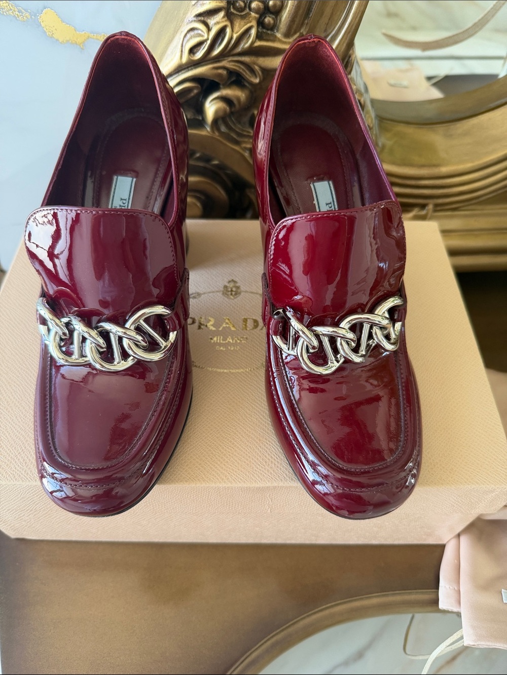 Prada Burgundy Patent Leather Loafers with Gold Chain. Very comfortable heel.